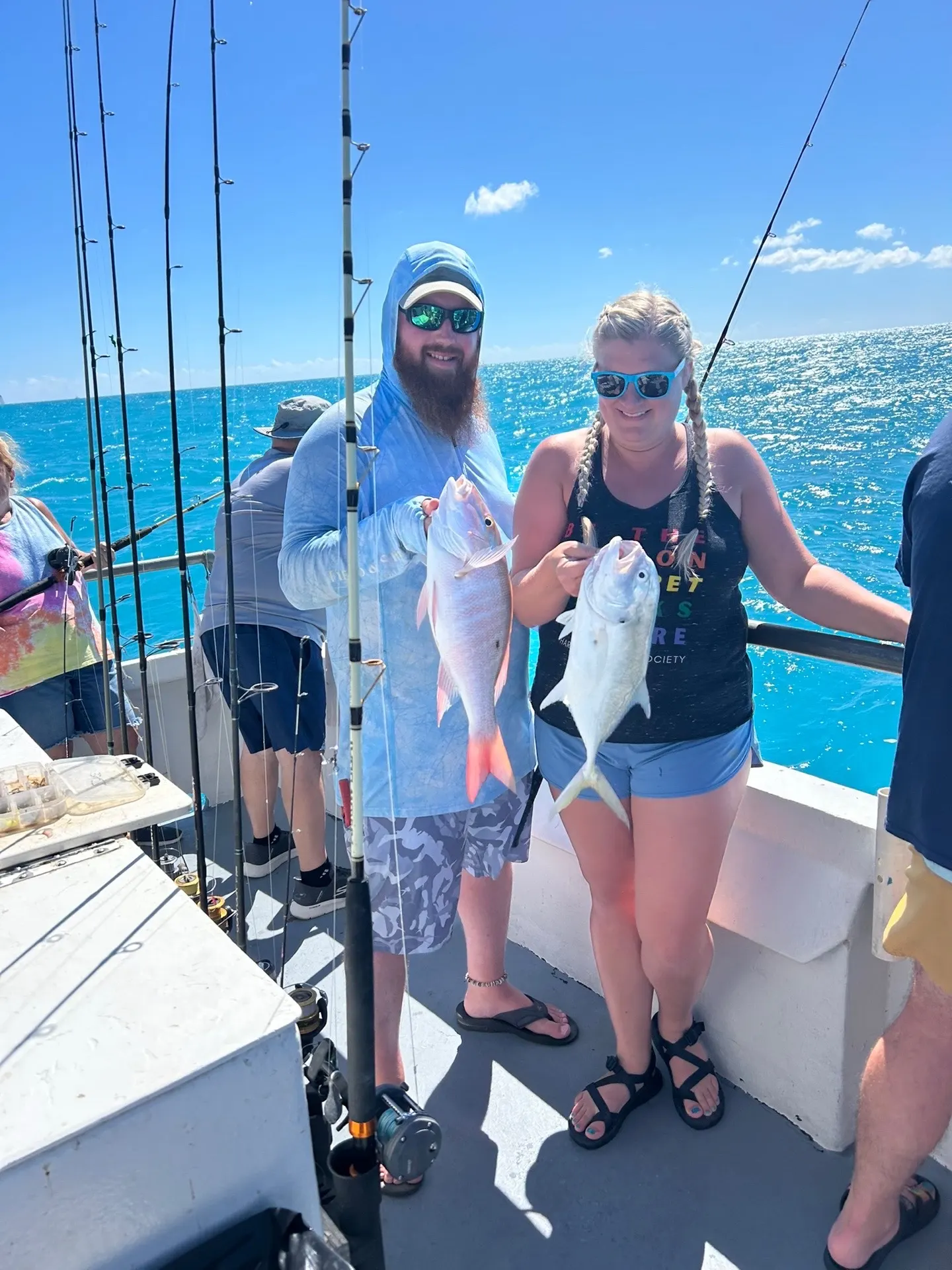 Couple showing off double catch snapper and jack on Gulfstream fishing trip Key West