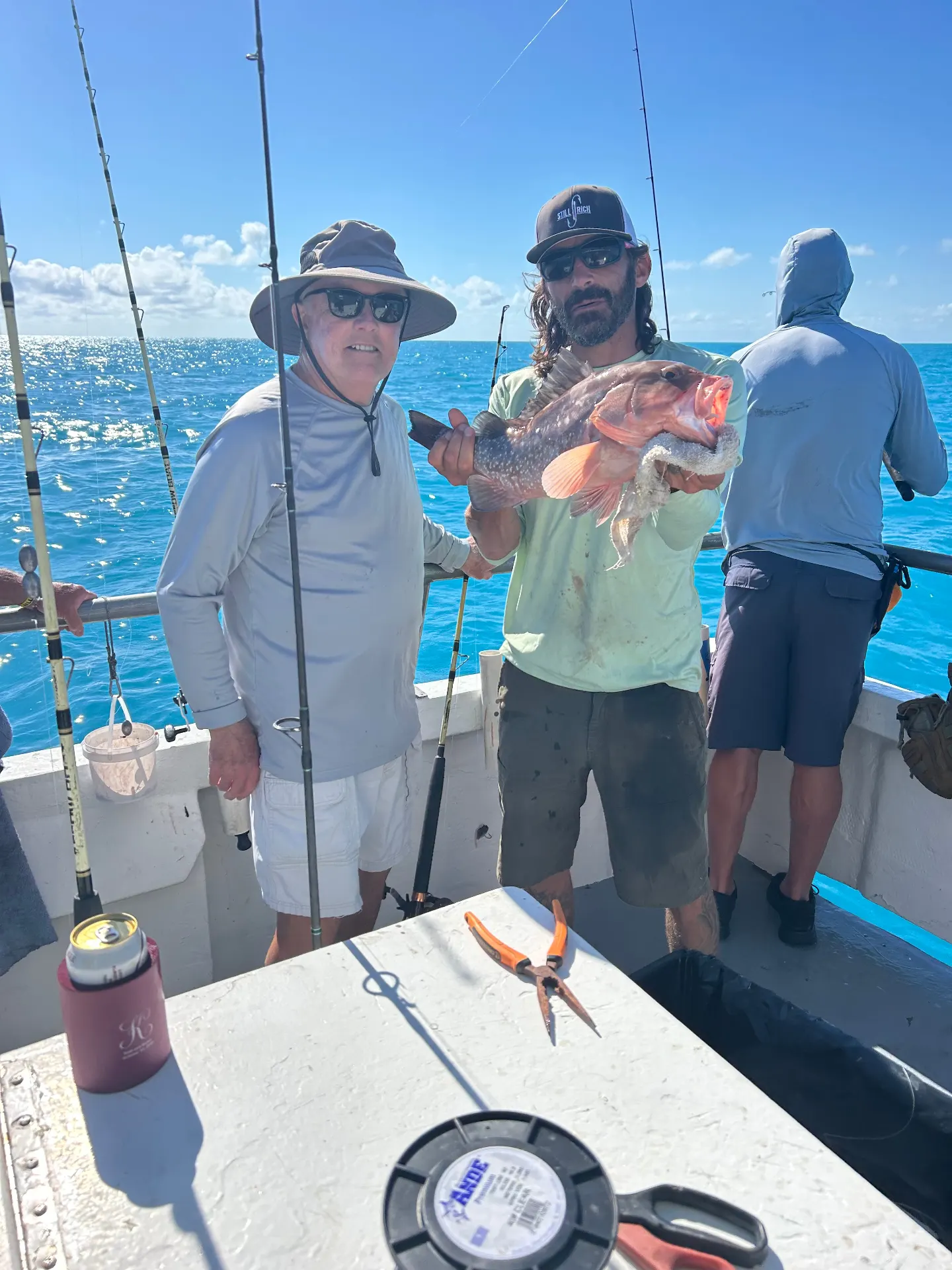 Red grouper catch on Gulfstream party boat deep sea fishing Key West Florida
