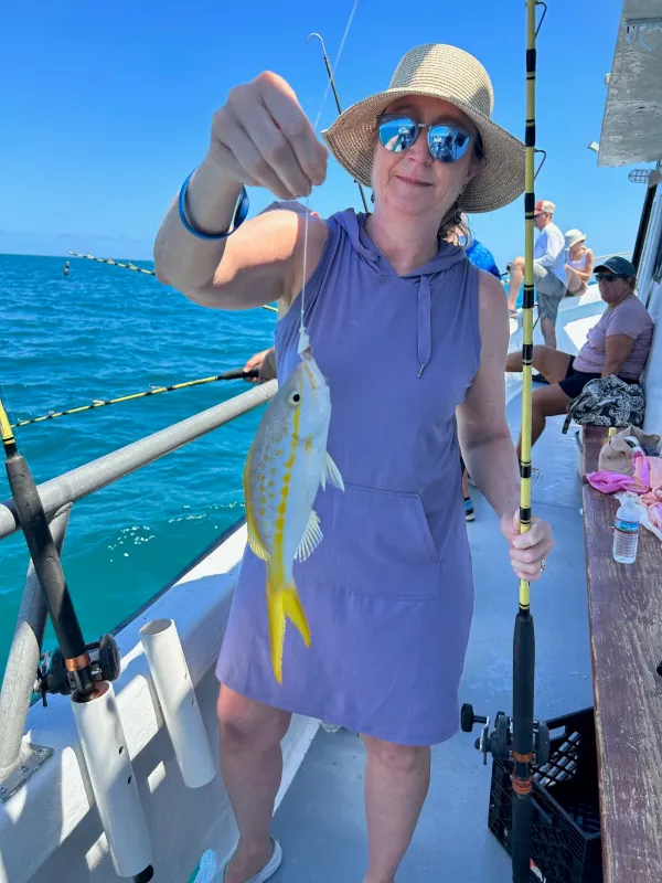 a couple of people that are standing in the water