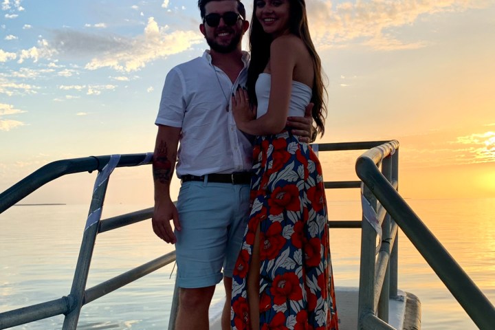 a person standing in front of a body of water