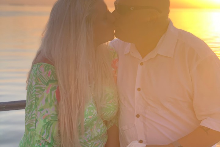 a man and a woman looking at the camera