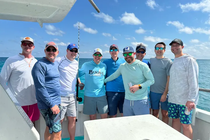 a group of people fishing in Key West